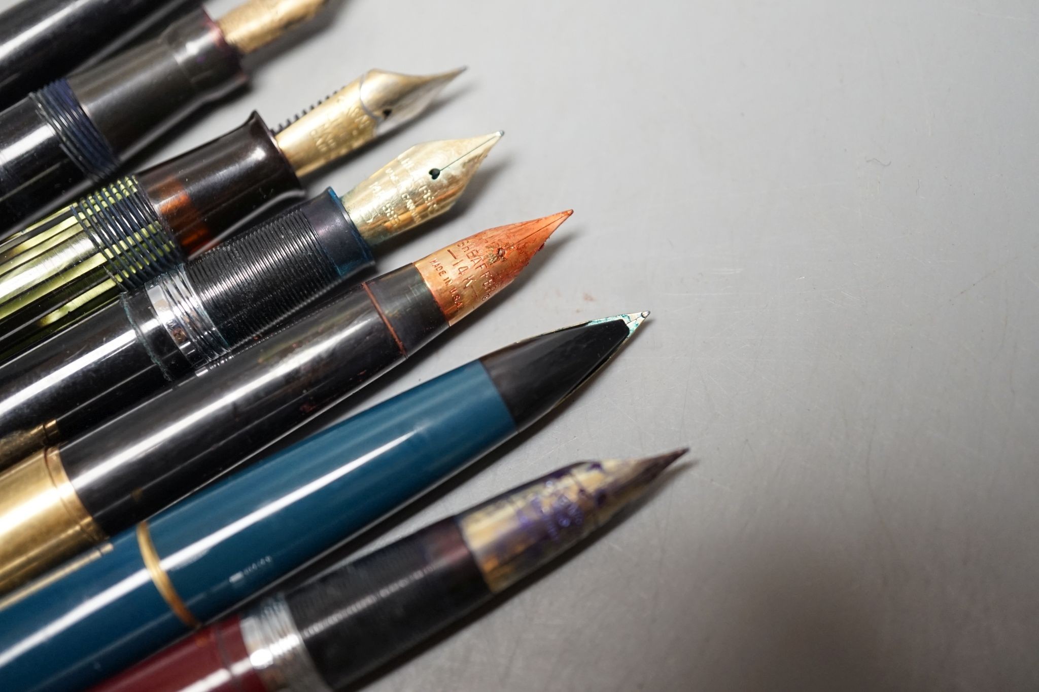 Seven assorted pens including fountain pen with 18ct gold nib.